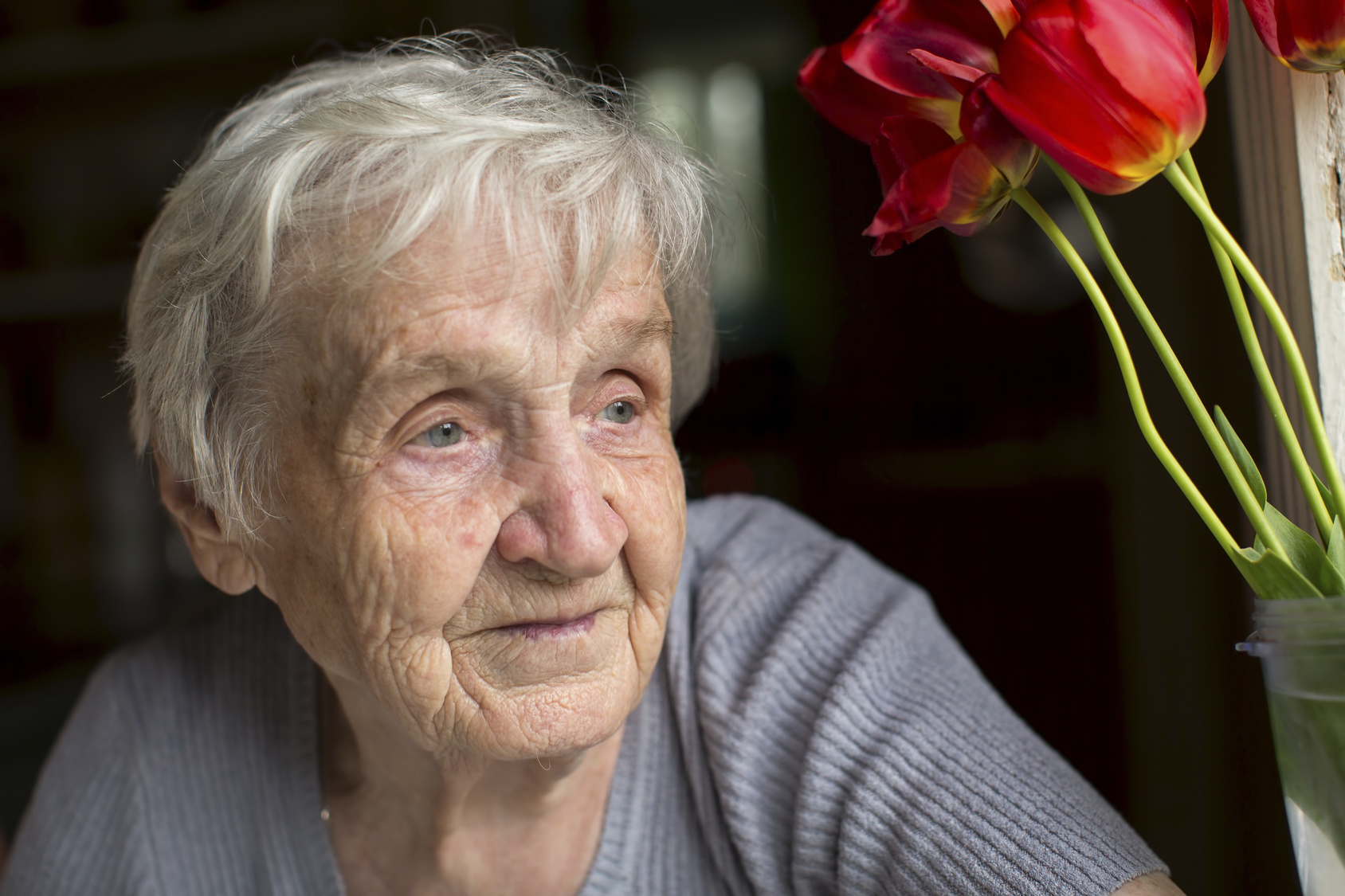 Close-up portrait of an elderly woman.